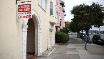 SAN FRANCISCO, CALIFORNIA - JUNE 02: A pedestrian walks by a "for rent" sign posted in front of an apartment building on June 02, 2021 in San Francisco, California. After San Francisco rental prices plummeted during the pandemic shutdown, prices have surged back to pre-pandemic levels. (Photo by Justin Sullivan/Getty Images)