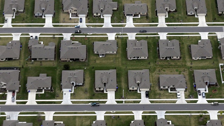 An aerial view of rows of suburban homes.