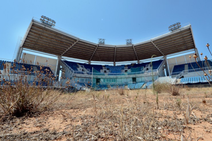 ATHENS, GREECE - JULY 31: General view of the Olympic Softball stadium at the Helliniko Olympic complex in Athens, Greece on July 31, 2014. Ten years ago the XXVIII Olympiad was held in Athens from the 13th - 29th August with the motto "Welcome Home". The cost of hosting the games was estimated to be approx 9 billion euros with the majority of sporting venues built specifically for the games. Due to Greece's economic frailties post Olympic Games there has been no further investment and the majority of the newly constructed stadiums now lie abandoned. (Photo by Milos Bicanski/Getty Images)