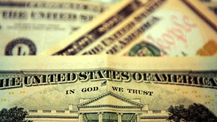 In this photo illustration the phrase "In God We Trust" can be seen on an American ten dollar bill on October 23, 2008 in London, England.