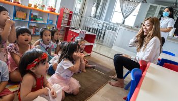 Ngoc Ho sings in English and Vietnamese with her young class at Dino Land Academy.