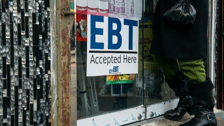 A sign at a New York grocery store alerts customers about food stamp benefits.