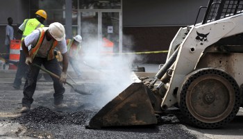 District Department of Transportation contractors had to deal with a heat index temperature over 100 degrees (F) (37.7C), as well as the steaming asphalt they were spreading on July 22, 2010 in the Mount Pleasant neighborhood of Washington, DC.