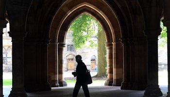 A student walks on the campus of University of Glasgow in Scotland on Sept. 24, 2020.