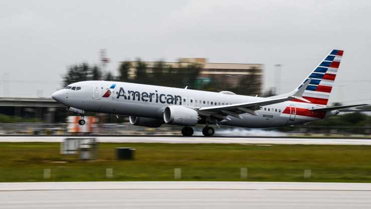 An American Airlines plane lands at the Miami International Airport on June 16.