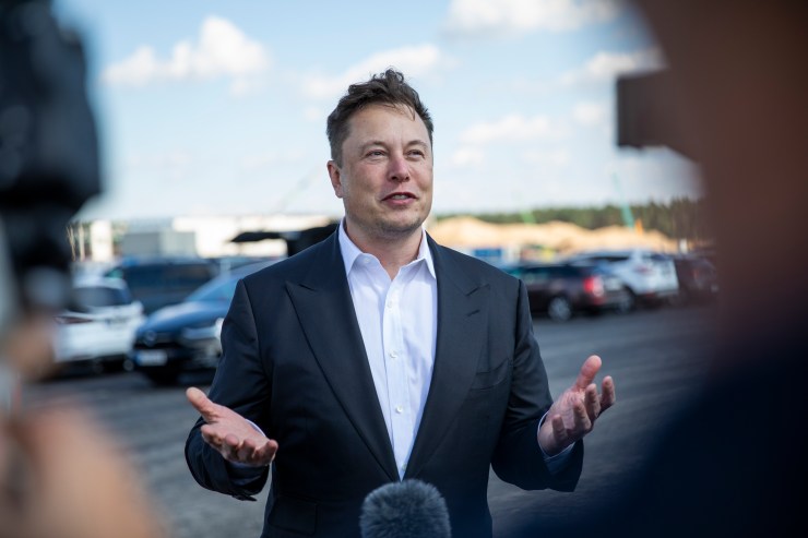 Tesla CEO Elon Musk talks to the press at the construction site of a Tesla Gigafactory near Berlin in 2020.