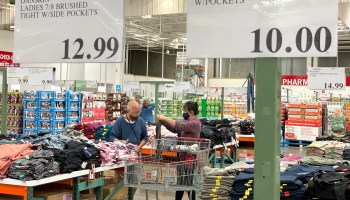 Customers shop for clothing at a Costco store in Novato, California.