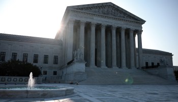 The sun rises behind the U.S. Supreme Court building on Aug. 27 in Washington, D.C.