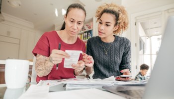 LGBTQ couple dealing with finances.