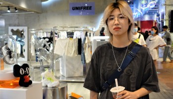 Finance major Zhou Hui, 19, in a boutique.