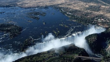 An aerial view of Victoria Falls on the Zambezi River at the border between Zambia and Zimbabwe.