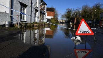 A sign warns of flooding in Tewkesbury, Gloucestershire, western England, on Feb. 20, 2020.