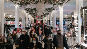 With Christmas only one day away, holiday shoppers make a last-minute trip to the Macy's flagship department store in Midtown, Manhattan on December 24, 2020 in New York City.