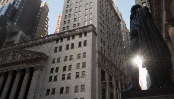 View of the New York Stock Exchange (NYSE) and a statue of George Washington at Wall Street on March 23, 2021 in New York City.