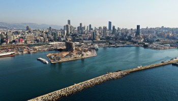 This picture taken on August 4, 2021 shows an aerial view of the damaged grain silos at the port of Lebanon's capital Beirut on the first anniversary of the blast that ravaged the port and the city.