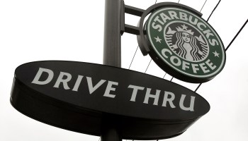 A Starbucks drive-thru sign is seen outside its store December 28, 2005 in Wheeling, Illinois.