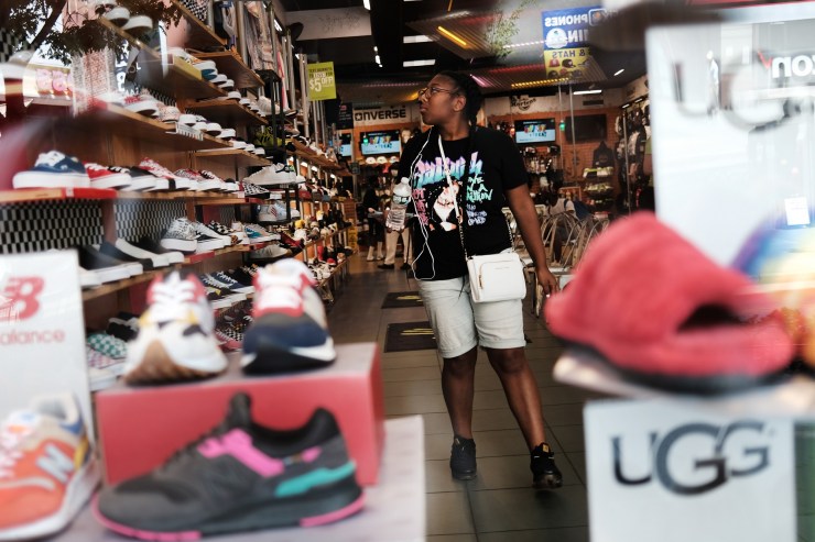 A person looks at sneakers in a store in Brooklyn on July 16, 2021 in New York City.