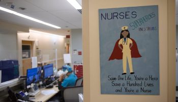 A poster lauding nurses'efforts hangs at Martin Luther King Jr. Community Hospital in Los Angeles. The COVID pandemic has put more demands on nurses — and created more demand for nurses.