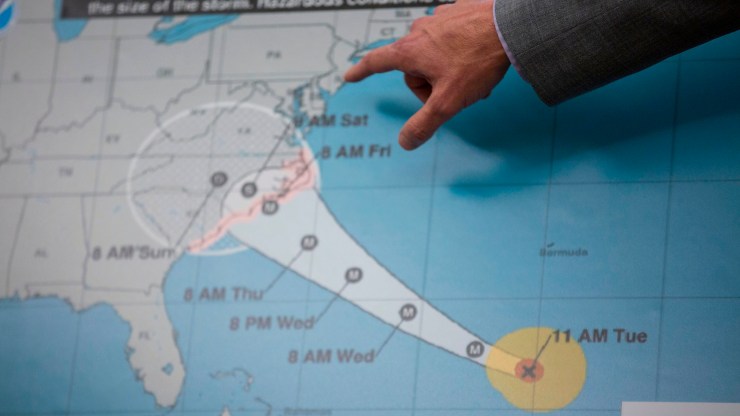 Former administrator of the Federal Emergency Management Agency Brock Long points to a map showing the expected trajectory of Hurricane Florence after briefing President Donald Trump on the storm in the Oval Office at the White House September 11, 2018.