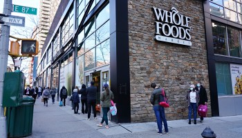People are seen lined up in front of Whole Foods during the coronavirus pandemic on April 15, 2020 in New York City.