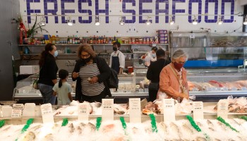 Customers shop for fresh fish at Fresh Meat Seafood Market on July 28, 2021 in San Francisco, California.