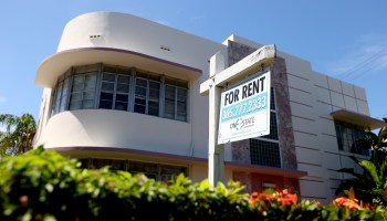A rent sign hangs outside of a building on September 29, 2021 in Miami, Florida.