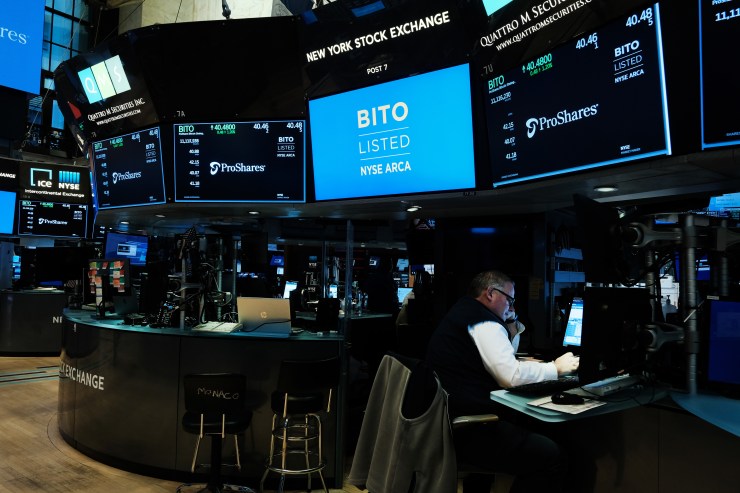 A Bitcoin banner flashes on the screen of the floor of the New York Stock Exchange.