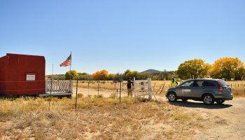 A vehicle from the medical investigator's office enters the front gate leading to the Bonanza Creek Ranch on Oct. 22 in Santa Fe, New Mexico.