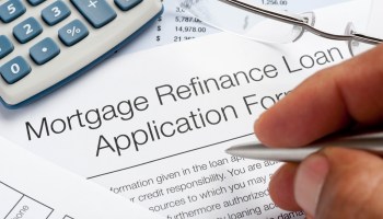 Close-up image of a mortgage refinance application form being filled out