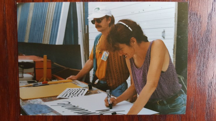Nan Parati makes a sign at the New Orleans Jazz & Heritage Festival circa 1990.