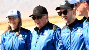 The crew of the Blue Origin spaceflight attends a press conference at the New Shepard rocket landing pad on Wednesday. William Shatner of "Star Trek" fame, second from the left, became the oldest person to fly into space at age 90.