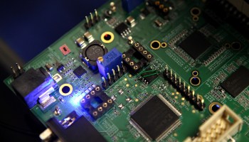 Semiconductors are seen on a circuit board that powers a Samsung video camera.