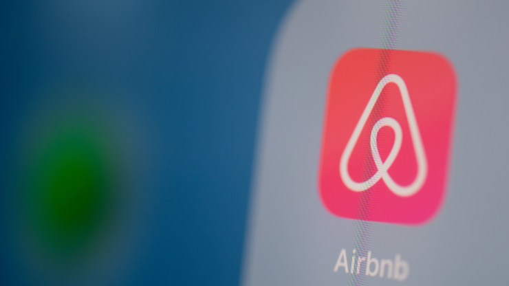 This illustration picture taken on July 24, 2019 in Paris shows the logo of the US online booking homes application Airbnb on the screen of a tablet.