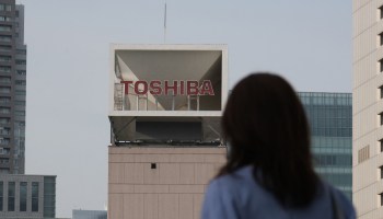 The Toshiba logo is displayed at the company's headquarters in Tokyo.