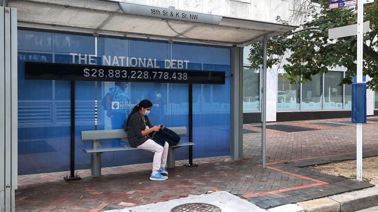 A sign at a Washington, D.C., bus stop showed the amount of the national debt on Oct. 25.