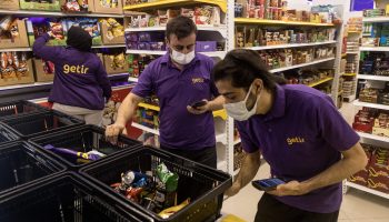 Getir employees prepare online grocery orders for delivery at a store warehouse on October 22, 2021 in Istanbul, Turkey.