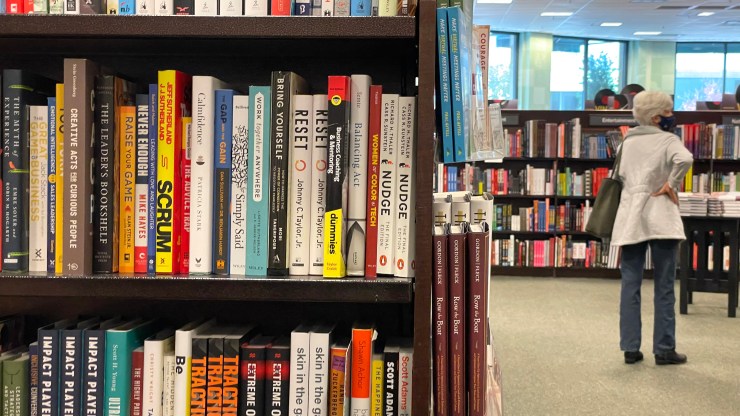 A customer shops for books at a Barnes & Noble store.
