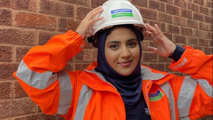 Aminah Shafiq wears the PPE-specific headscarf she designed, which can be worn with a protective helmet.