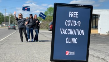 An outdoor sign for a COVID-19 vaccination clinic.