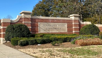 An exterior sign reading "Tennessee State University" is shown. From 1957 to 2007, the HBCU received far less money than it was due by virtue of its federal land-grant designation.