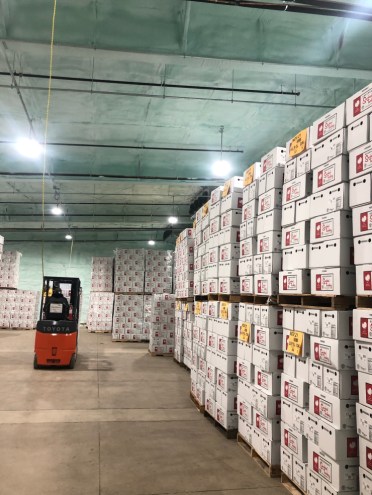 Pallets of turkeys and a forklift are shown.