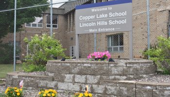 A sign showing the Coper Lake and Lincoln Hills schools in remote Wisconsin.