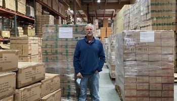 David Erlanger in front of palletized imports at his main warehouse in Riverside, California.