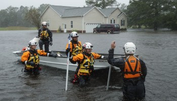 A FEMA task force searches a flooded North Carolina neighborhood in 2018.