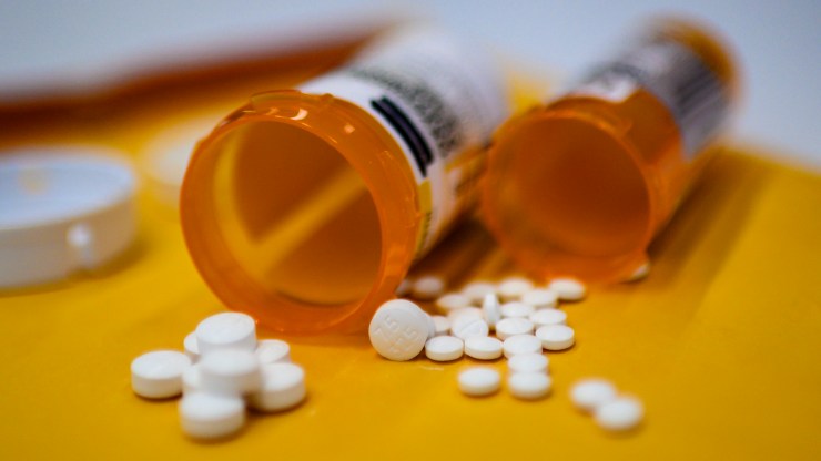 This illustration image shows tablets of opioid painkiller Oxycodon delivered on medical prescription taken on September 18, 2019 in Washington,DC. - Millions of Americans sank into addiction after using potent opioid painkillers that the companies churned out and doctors freely prescribed over the past two decades. Well over 400,000 people died of opioid overdoses in that period, while the companies involved raked in billions of dollars in profits. And while the flood of prescription opioids into the black market has now been curtailed, addicts are turning to heroin and highly potent fentanyl to compensate, where the risk of overdose and death is even higher. (Photo by Eric BARADAT / AFP) (Photo by ERIC BARADAT/AFP via Getty Images)