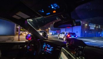 A police cruiser takes part in a pursuit with other cruisers as they attempt to catch a man who stole a car and sped away in Chelsea, Massachusetts on May 1, 2021.