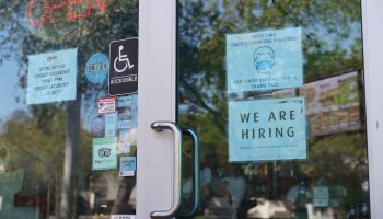 A "We Are Hiring" sign in front of a store on March 5, 2021 in Miami, Florida.