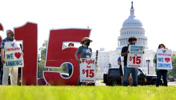Labor activists hold a rally in support of raising the minimum wage to $15 an hour on the National Mall on May 19, 2021 in Washington, DC.