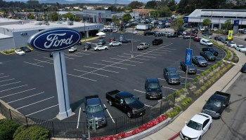 In an aerial view, the sales lot at Hilltop Ford is nearly empty on July 9 in Richmond, California.