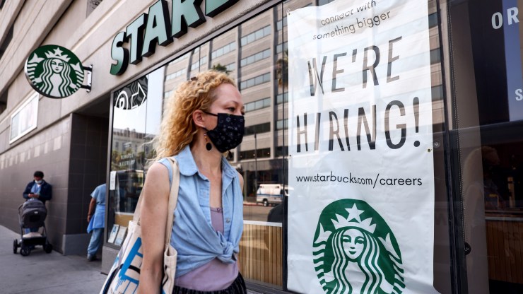 LOS ANGELES, CALIFORNIA - AUGUST 06: A 'We're Hiring!' sign is posted at a Starbucks on August 06, 2021 in Los Angeles, California. The U.S. economy added over 900,000 jobs in July, the biggest monthly gain since August of last year. (Photo by Mario Tama/Getty Images)